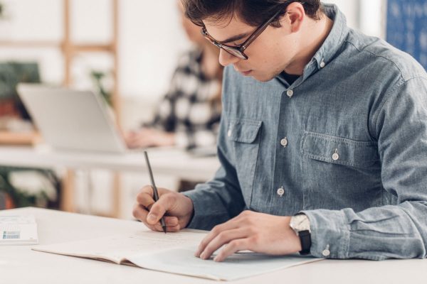 Ethics - Man writing exam